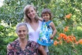 Family portrait in a garden, three generations Royalty Free Stock Photo