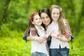 Family portrait of girls and mother in the park on a background