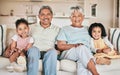 Family in portrait, grandparents and children with smile, relax at home with love and bonding together on sofa