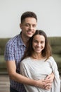 Family portrait of happy couple smiling to camera Royalty Free Stock Photo