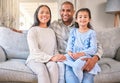 Family, portrait and happy on sofa in home living room, bonding and having fun. Care, parents and smile of child, mother Royalty Free Stock Photo