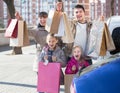 Family portrait with many purchases in bags Royalty Free Stock Photo