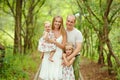 Family portrait - mother, father and two daughters blonde walkin Royalty Free Stock Photo