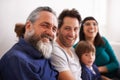 Family, portrait and parents, grandfather and child in living room, happy together with generations and love. Bonding Royalty Free Stock Photo