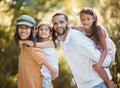 Family portrait, piggy back and love in park, happy smile and care together in nature park together in summer. Mother