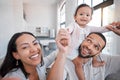 Family, portrait and playing with a mother, father and baby girl being playful and cheerful in the family home. Fun Royalty Free Stock Photo