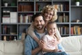 Family portrait smiling grandmother hugging adult son and little granddaughter Royalty Free Stock Photo