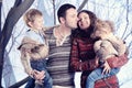 Family portrait standing on studio snow forest background Royalty Free Stock Photo