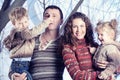 Family portrait standing on studio snow forest background Royalty Free Stock Photo