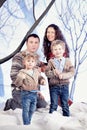 Family portrait in studio snow forest background Royalty Free Stock Photo