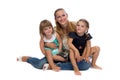 Family portrait of a young charming mother and two daughters. Royalty Free Stock Photo