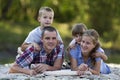 Family portrait of young happy mother, father and two cute blond Royalty Free Stock Photo