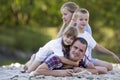 Family portrait of young happy mother, father and two cute blond Royalty Free Stock Photo