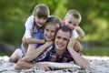 Family portrait of young happy mother, father and two cute blond Royalty Free Stock Photo