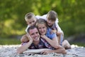 Family portrait of young happy mother, father and two cute blond Royalty Free Stock Photo