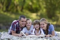 Family portrait of young happy mother, father and two cute blond Royalty Free Stock Photo