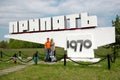 Family poses for photo in Pripyat, Chernobyl Exclusion Zone