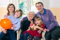 Family posing with grandma.