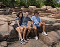 Family posing for a picture on the rugged rocks near Thunder Hole on the Atlantic Ocean, Bar Harbor, Maine. Royalty Free Stock Photo