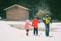 Family practicing cross-country skiing. The volcano Mount Etna, Sicily. Italy.