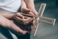 Family prayer with wooden cross Royalty Free Stock Photo