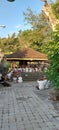 the family prays together at one of the temples in a series of Ngaben ceremonies in Bali