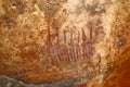 Family in prehistoric bushman's rock pictograph