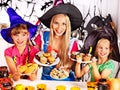 Family preparing halloween food.