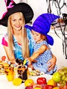 Family preparing halloween food.