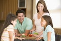 Family Preparing A Meal Together Royalty Free Stock Photo