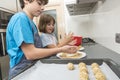 Family preparing sweets in the kitchen Royalty Free Stock Photo