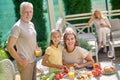 Family preparing for the thanksgiving dinner and looking involved Royalty Free Stock Photo