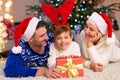 Family with presents at Christmas time Royalty Free Stock Photo