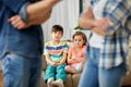 Children watching their parents quarreling at home Royalty Free Stock Photo