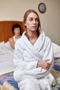 Family conflict. Young couple quarrels in bedroom at home.  Selective focus on woman Royalty Free Stock Photo