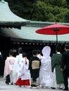 Family in a procession during a ceremony of a traditional Japanese wedding.