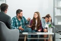 Family at psychology session. Psychologist helping young family with a child to solve teenagers problems. Royalty Free Stock Photo