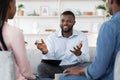 Family Psychotherapy. Friendly Black Therapist Consulting African American Couple At His Office Royalty Free Stock Photo