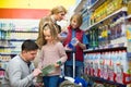 Family purchasing sparkling water in store Royalty Free Stock Photo