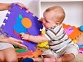 Family puzzle making mother and baby. Child jigsaw develops children. Royalty Free Stock Photo