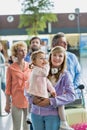 Family queuing for check in at airport