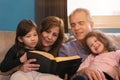 Family Reading the Bible together Royalty Free Stock Photo