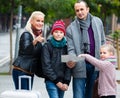 Family reading city map Royalty Free Stock Photo