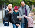 Family reading city map Royalty Free Stock Photo