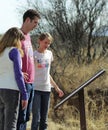 A Family Reads a Sign at the Murray Springs Clovis Site