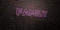 FAMILY -Realistic Neon Sign on Brick Wall background - 3D rendered royalty free stock image