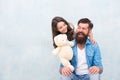 Family relations. Fathers day concept. Giving soft toy teddy bear. Lovely father and kid. Father and daughter light