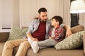 Father talking to his sad little son at home Royalty Free Stock Photo