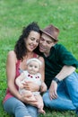 Family relaxes in a meadow