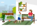 The family is relaxing on the balcony. The girl is playing with the dog, the cat is resting on the couch. Royalty Free Stock Photo